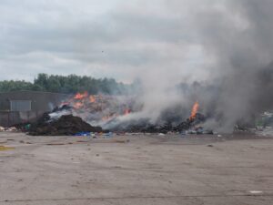 Photo of a fire at a waste management facility.